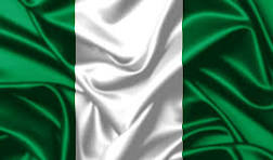 Nigerian flag with three vertical stripes in green, white, and green, displayed on a silky fabric background with gentle folds, creating a sense of pride and elegance. No visible text in the image.